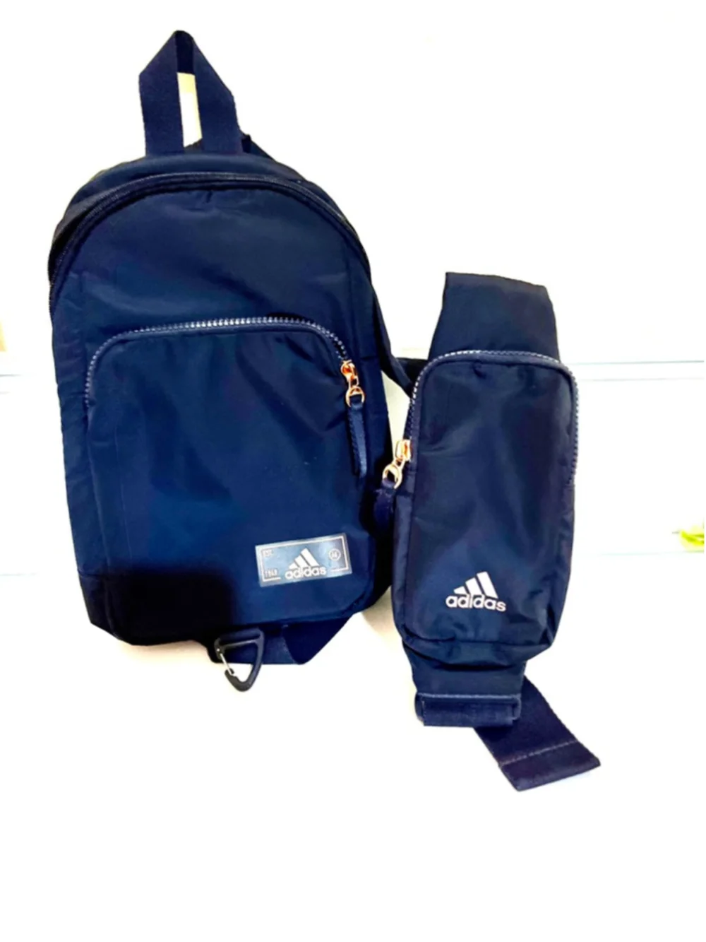 adidas Essentials 2 Sling Crossbody Bag in a Legend Ink blue color unisex